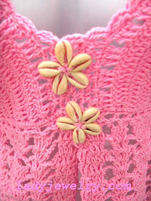 Retail boutique bali fashion clothing, Fun pink halter top in unique knit pattern with seashell beading in center 