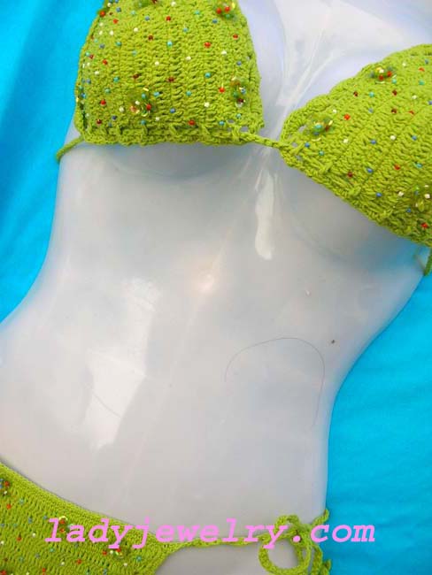 Exotic green balinese crochet knit beach bikini with trendy beads and flowers made from sequin . Beauty beach supply store 